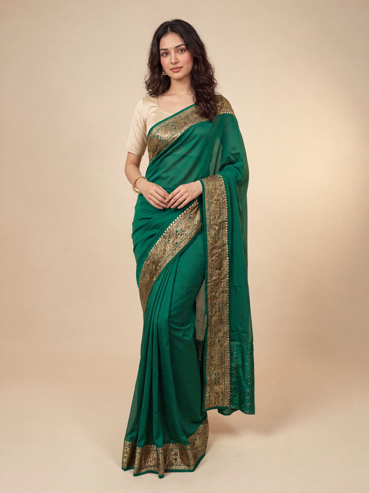 Siya wearing the same emerald-green silk saree in a studio